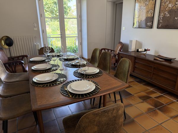 The dining room set for 8 places